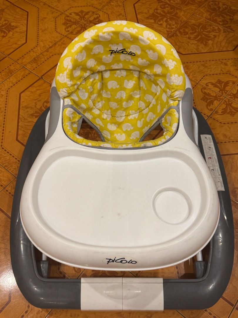 Piccolo Baby Walker with Activity Tray and Parent Handle (Category: Infant Playtime) located in Quezon City. Submitted by docagillemontemayor (Listing ID 1463246740, Image 3). Description: Bought this at Baby Company for almost 6K. Used indoors only for 2months. Baby has another walker for outdoors. Unique design and toy for your baby's motor skill💯🪄 - Interactive activity tray with engaging toys and buttons to keep baby entertained. - Includes