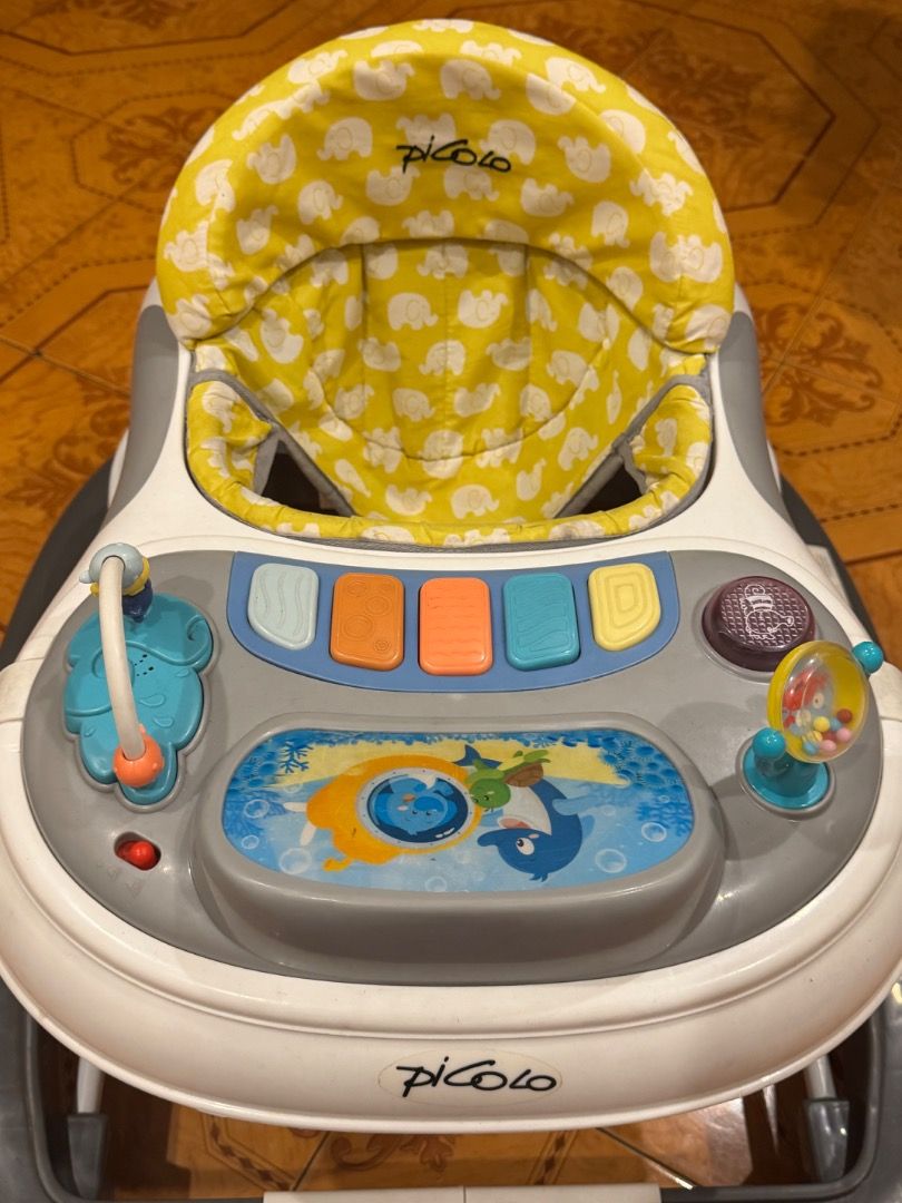 Piccolo Baby Walker with Activity Tray and Parent Handle (Category: Infant Playtime) located in Quezon City. Submitted by docagillemontemayor (Listing ID 1463246740, Image 2). Description: Bought this at Baby Company for almost 6K. Used indoors only for 2months. Baby has another walker for outdoors. Unique design and toy for your baby's motor skill💯🪄 - Interactive activity tray with engaging toys and buttons to keep baby entertained. - Includes