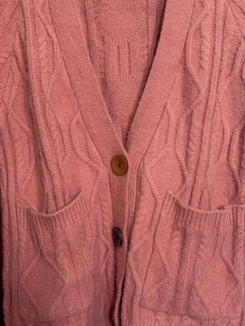 Pink Cable Knit Button Up Cardigan with Pockets (Category: Coats, Jackets and Outerwear) located in Taguig. Submitted by cftbncs (Listing ID 1463176220, Image 2). Description: - Cozy pink cable knit cardigan - V-neck design - Button-up front closure - Two convenient front pockets - Soft and warm material, ideal for layering - very heavy - Perfect for cooler weather and versatile styling.
