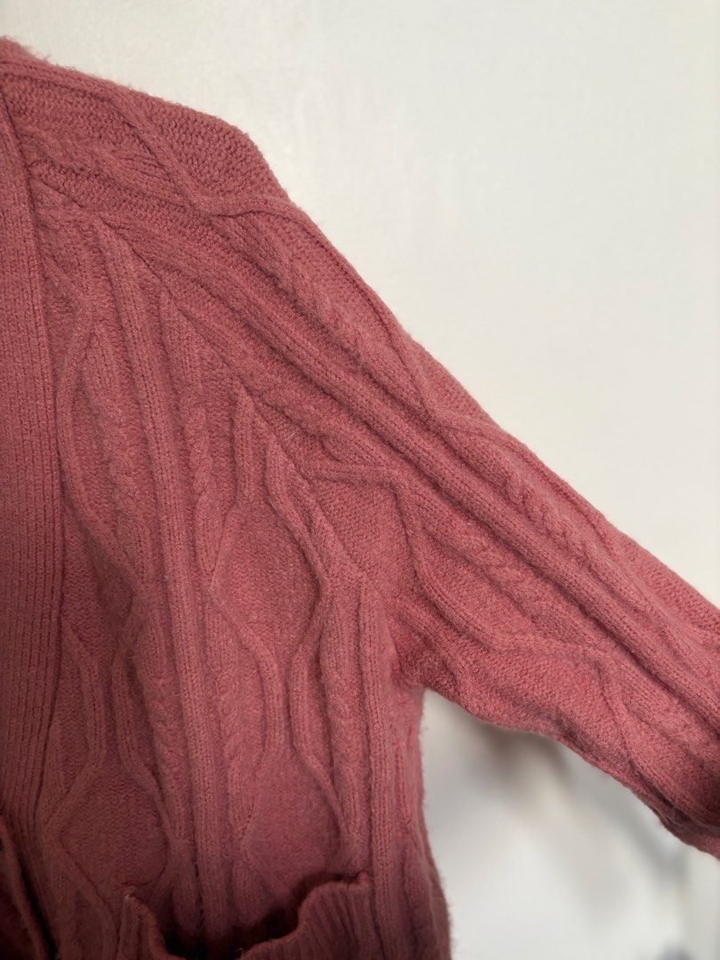 Pink Cable Knit Button Up Cardigan with Pockets (Category: Coats, Jackets and Outerwear) located in Taguig. Submitted by cftbncs (Listing ID 1463176220, Image 3). Description: - Cozy pink cable knit cardigan - V-neck design - Button-up front closure - Two convenient front pockets - Soft and warm material, ideal for layering - very heavy - Perfect for cooler weather and versatile styling.