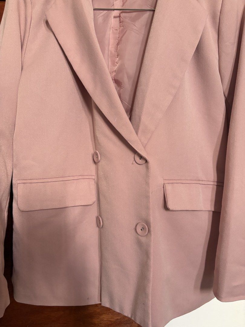 Pink Double-Breasted Blazer (Category: Coats, Jackets and Outerwear) located in Taguig. Submitted by cftbncs (Listing ID 1463176560, Image 2). Description: - Stylish pink double-breasted blazer - Two front buttons - Two functional pocket flaps - Fully lined with matching pink fabric - Versatile for casual or formal wear - Easy to style with various outfits - Ideal for layering.
