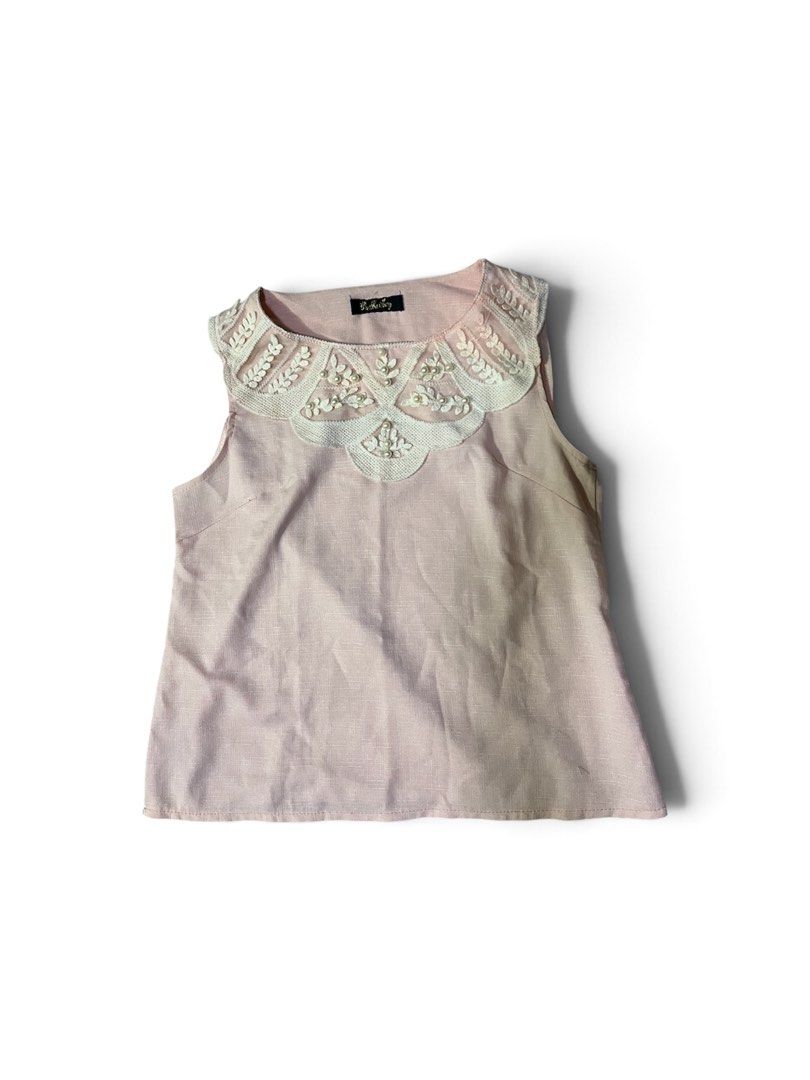 Pink Sleeveless Top with Lace Collar (Category: Sleeveless) located in Valenzuela. Submitted by _tann17 (Listing ID 1463173731, Image 1). Description: - Adorable pink sleeveless top - Features a pretty white lace collar with delicate bead details - Subtle textured fabric for a touch of elegance - Versatile piece: perfect for dressing up or down - Easily pairs with skirts or pants for various looks.