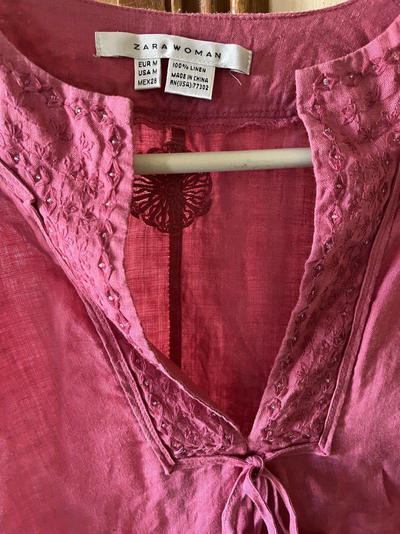 Pink top (Category: Others Tops) located in Bacoor. Submitted by ayit. (Listing ID 1463182304, Image 2). Description: Med-“large fit - Brand: Zara Woman - Color: Pink - Size: Medium (EU 38 / UK 10 / US 6) - Material: 100% Linen - Features: Embroidered neckline, tie-front detail - Condition: Great - Perfect for casual wear and warm weather.