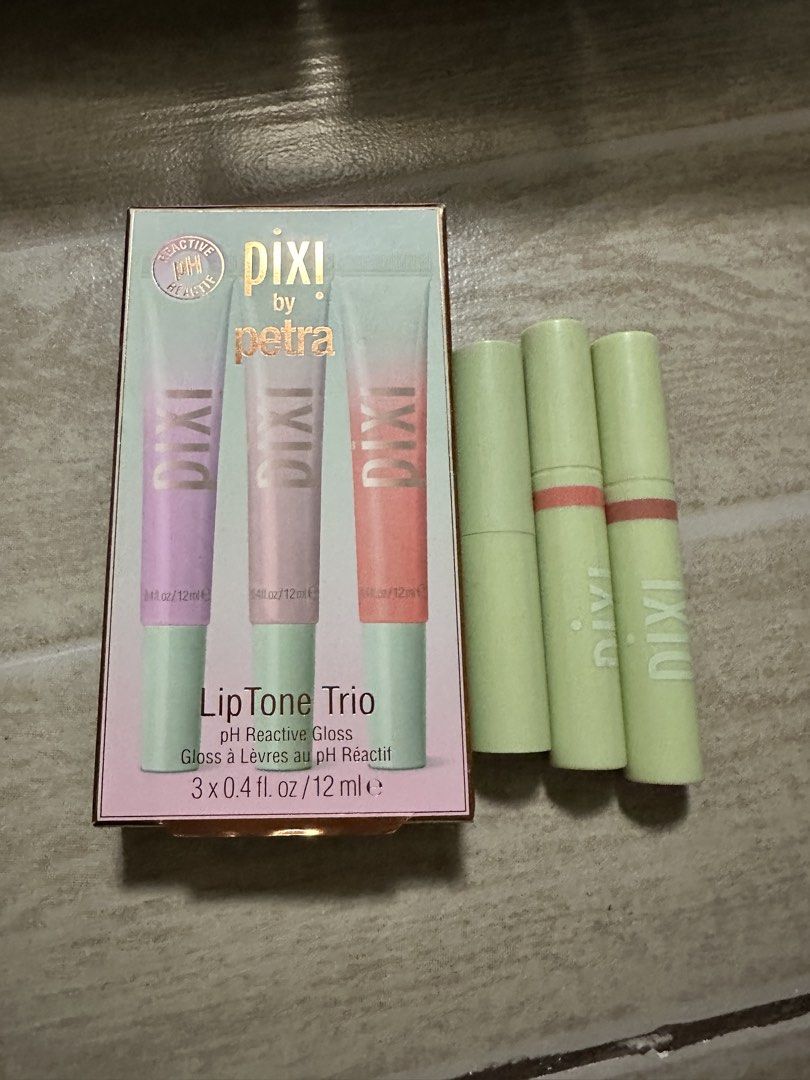 Pixi by Petra LipTone Trio pH Reactive Gloss Bundle (Category: Makeup) located in Quezon City. Submitted by faststone.ba186f (Listing ID 1463237629, Image 1). Description: - Pixi by Petra LipTone Trio - Set includes 2 pH reactive gloss shades - Each gloss customizes color based on your pH - Great for experimenting with different lip looks - Lip balm with Vitamin C - 2pcs lip stain shades: Purity and Beauty - Take all for p850.