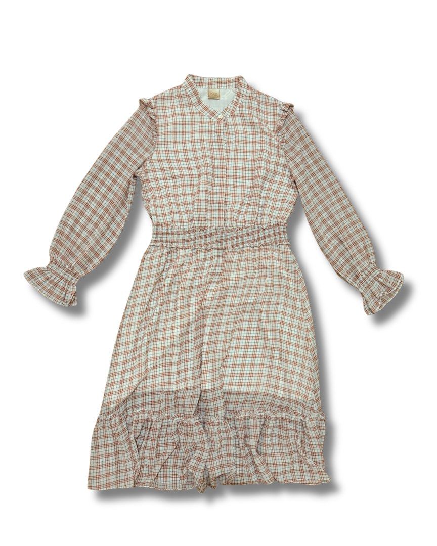 Plaid Long Sleeve Ruffled Dress (Category: Dresses) located in Subic. Submitted by ciesells (Listing ID 1463148972, Image 1). Description: Bust: 36 Waist: 28 inches (36 when fully strecthed) Length: 40 inches Sleeve: 22 ½ inches - Midi dress - Complete buttons (hidden) - Double lining mop: bpi/maya/maribank.