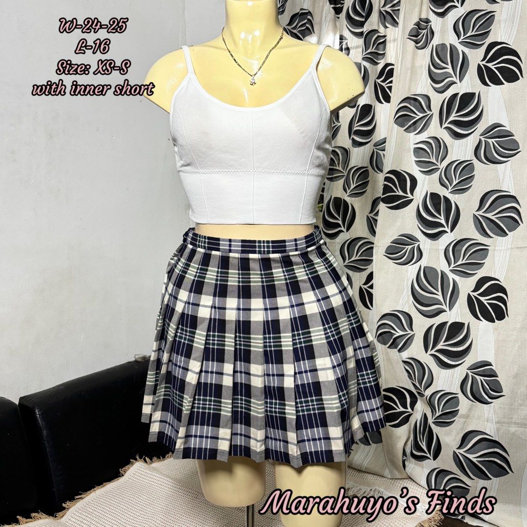 Pleated Plaid Mini Skirt with Inner Short (Category: Skirts) located in Mabalacat. Submitted by marahuyos.finds (Listing ID 1463231351, Image 1). Description: - Cute pleated plaid skirt - Built-in inner shorts for comfort and coverage - Waist: 24-25 inches - Size: XS-S - Versatile for casual or dressed-up outfits - Easy to style with various tops and shoes.