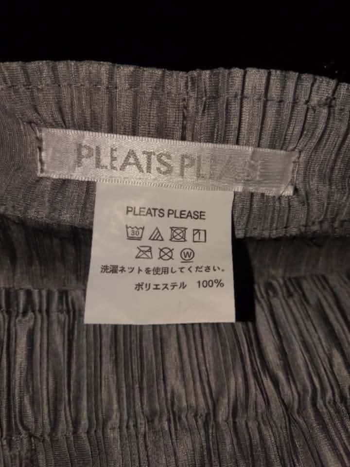 Pleats Please Issey Miyake Pleated Pants Size 2 (Category: Other Bottoms) located in Lapu Lapu. Submitted by margaux099 (Listing ID 1463238612, Image 2). Description: - Authentic Pleats Please Issey Miyake Pants - Color: Grey - Size: 2 - Material: 100% Polyester - Features: Signature pleats, elastic waistband for comfort - Origin: Made in Japan - Style: Great for everyday wear.