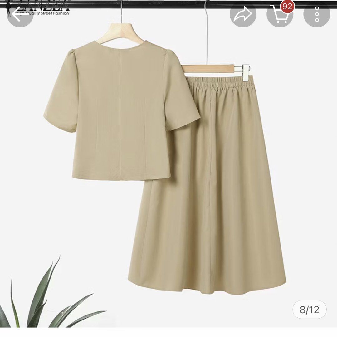 Plus size coordinates - skirt and blouse (Category: Sets or Coordinates) located in Manila. Submitted by mrgfp (Listing ID 1463265691, Image 2). Description: Worn once -perfect for 44-46 bust, 38-42 waist Selling a beige two-piece set from Zanzea. Includes a short-sleeve button-up top and a pleated midi skirt. Both pieces have button details. Great for work or casual wear. Check the size chart for measurements. Top has puff sleeves. Skirt has a c