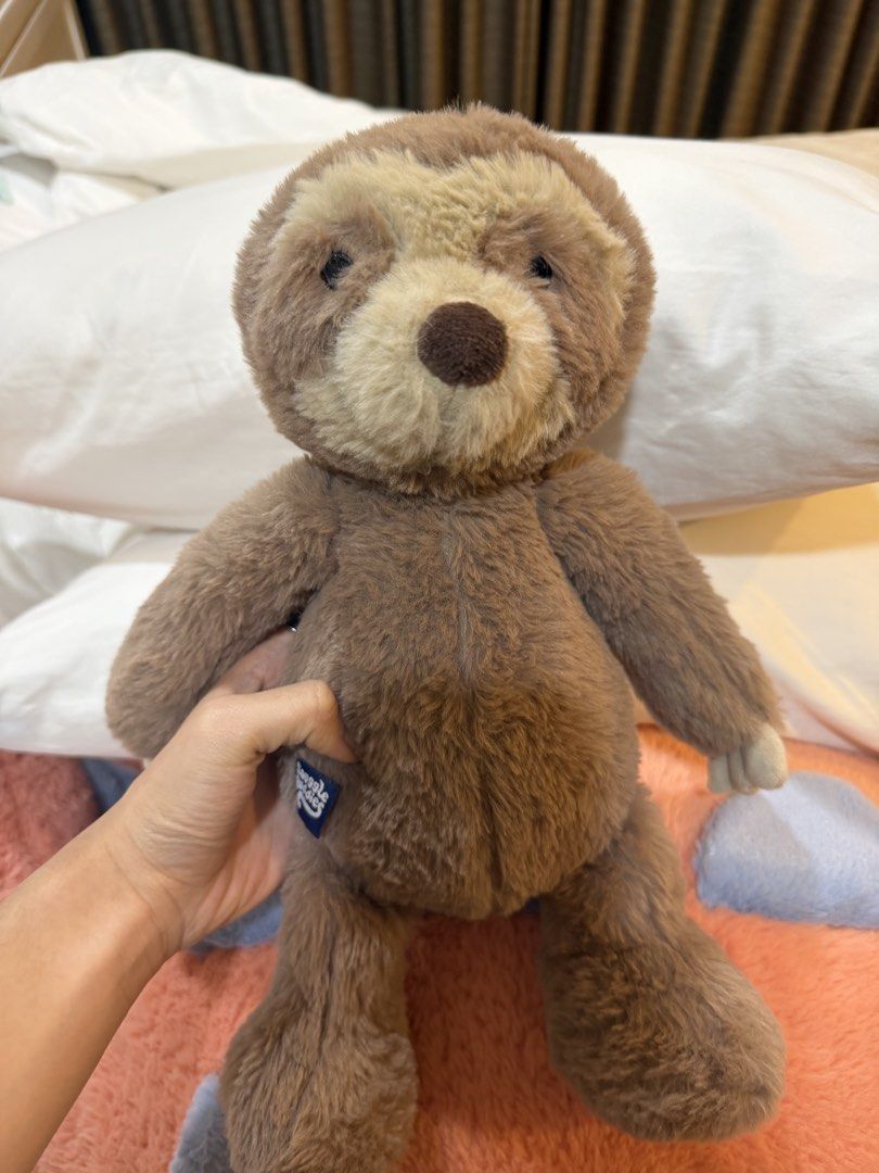 Plush Toy - Brown Sloth (Category: Plushies & Soft Toys) located in Makati City. Submitted by _saleph_ (Listing ID 1463153737, Image 1). Description: - Super soft brown sloth plush toy - Brand: Jellycat - Features a cute face - Great size for cuddling - Ideal for kids and collectors - Ready for a new home.