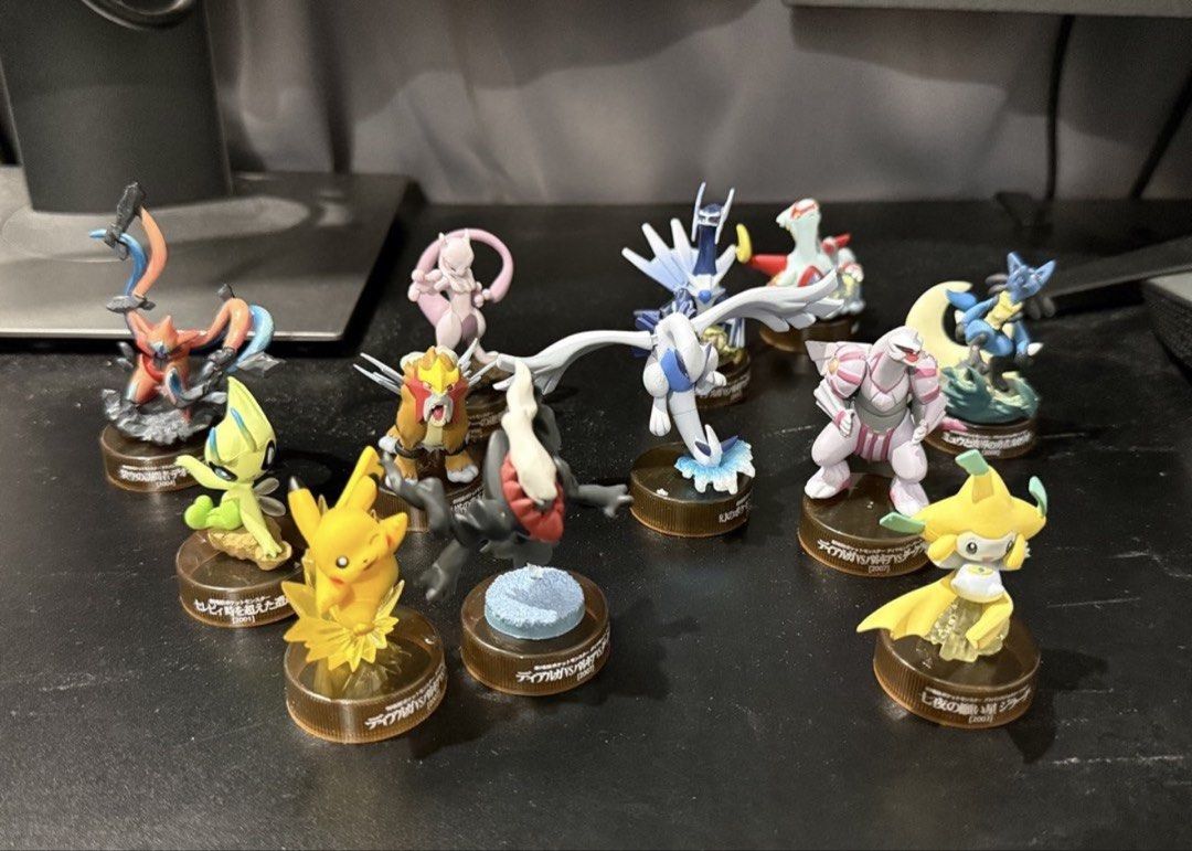 Pokemon Kaiyodo Bottle Cap - Action Figure Set (Category: Character Goods) located in Rodriguez. Submitted by babytoothy (Listing ID 1463169667, Image 1). Description: 12 pcs -Pikachu -Darkrai -Lugia -Deoxys -Celebi -Jirachi -Latias -Entei -Mewtwo -Palkia -Dialga -Lucario Very good condition.