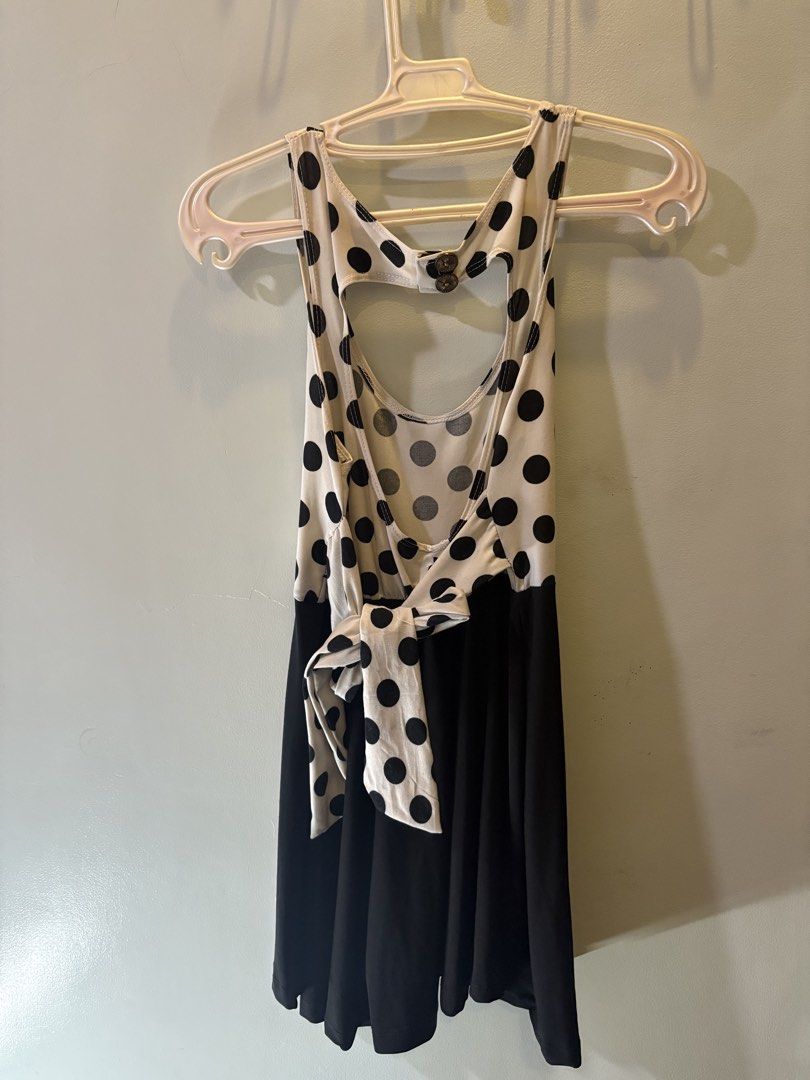 Polka Dot & Black Cut-out Back Dress (Category: Dresses) located in Valenzuela. Submitted by roxie018 (Listing ID 1463304601, Image 2). Description: - Adorable black and white polka dot top - Features a stylish cut-out detail at the back - Flattering tie-up detail at the waist - Contrasting plain black skirt - Versatile for casual outings or parties - Effortless to style.