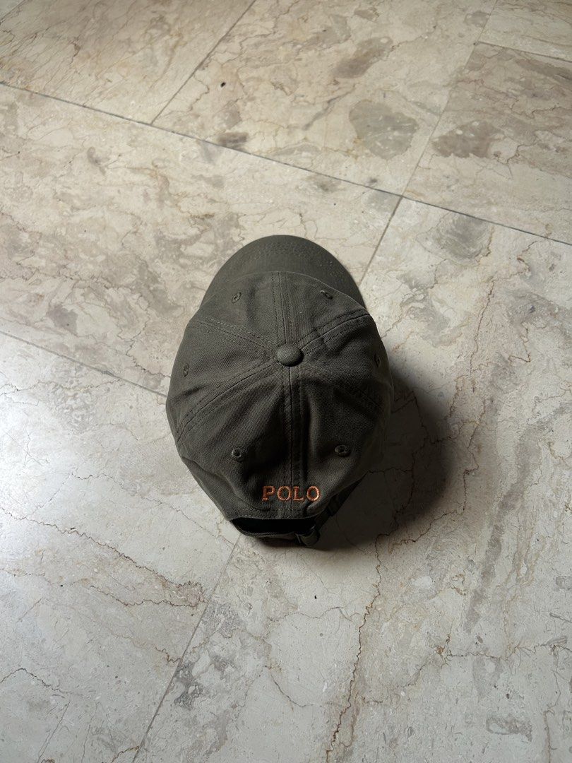Polo Ralph Lauren Cap Hat Olive Green (Category: Caps & Hats) located in Muntinlupa City. Submitted by wavesofara (Listing ID 1463125973, Image 2). Description: - Authentic Olive Green Polo Ralph Lauren Cap - Iconic Polo Player Logo Embroidery on Front - 'POLO' Text Embroidery on Back - Adjustable Strap for a Custom Fit - Ideal for Everyday Casual Wear.