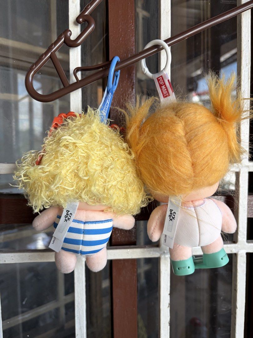 Pop Mart Crybaby Vacation Mode On Keychain Set (Category: Designer & Blind Box Toys) located in Las Pinas. Submitted by celly_belly (Listing ID 1463181470, Image 2). Description: - GET BOTH FOR 1K - SRP for one is 1150 - Keychain 1: Sunbathing - Keychain 2: Glug-glug - Both keychains have original tags attached - Comes with a complimentary white drawstring bag.