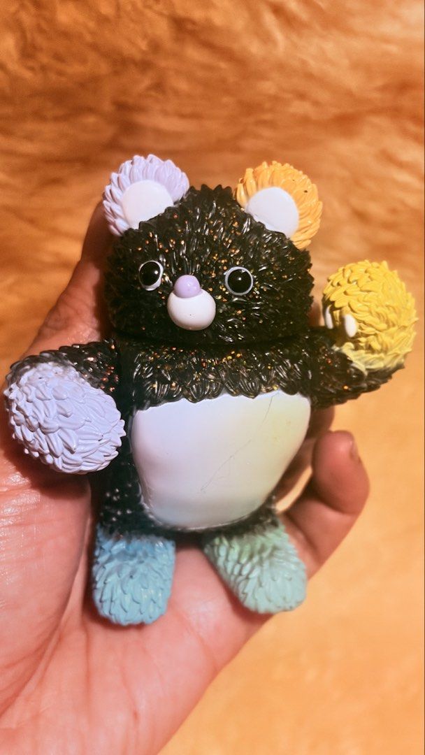 POP MART Instinctoy "Molly" Black Glitter Bear Figure (Category: Designer & Blind Box Toys) located in Baguio. Submitted by izza_thrifty (Listing ID 1463249497, Image 1). Description: - Authentic POP MART x Instinctoy collaboration - Striking black glitter finish - Adorable colorful pom-poms on ears and paws - Unique, playful toothy grin - Vibrant rainbow gradient body - Perfect collectible for toy enthusiasts.