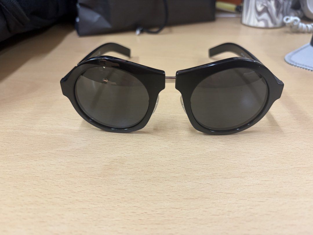 Prada Black Cat Eye Sunglasses (Category: Sunglasses & Eyewear) located in Makati City. Submitted by chumamba (Listing ID 1463123034, Image 2). Description: Prada Authentic Comes with Box Case Eyewear Grab or lala move at buyers expense. Meet up in glorietta makati - Authentic Prada sunglasses - Stylish black cat-eye frames - Comes with original Prada box and case - Includes authenticity card - Versatile for everyday or special occasions - Sellin