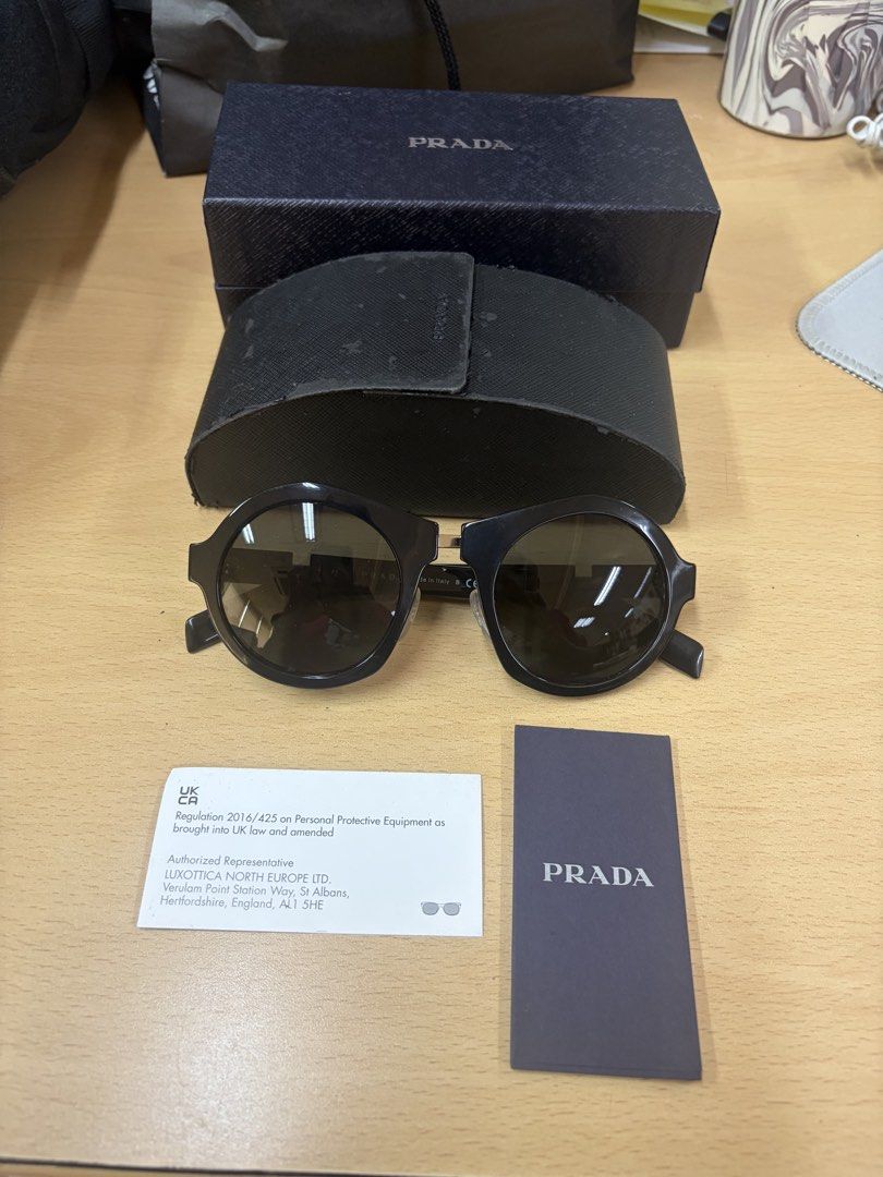Prada Black Cat Eye Sunglasses (Category: Sunglasses & Eyewear) located in Makati City. Submitted by chumamba (Listing ID 1463123034, Image 1). Description: Prada Authentic Comes with Box Case Eyewear Grab or lala move at buyers expense. Meet up in glorietta makati - Authentic Prada sunglasses - Stylish black cat-eye frames - Comes with original Prada box and case - Includes authenticity card - Versatile for everyday or special occasions - Sellin