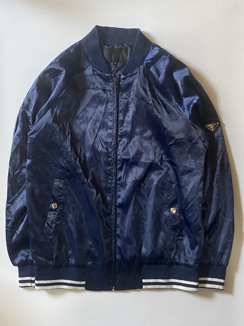 Prada Navy Bomber Jacket (Category: Coats, Jackets and Outerwear) located in Manila. Submitted by finofindthisart (Listing ID 1463240993, Image 2). Description: Length 27 Width 22 Measured it by inches P1499 Issue: N/A This is a pre-loved/thrifted items and may show minor signs of issue due to its vintage nature. Kindly manage expectations. No refunds or exchanges will be accepted. 📍Pasay City DM for inquiries..