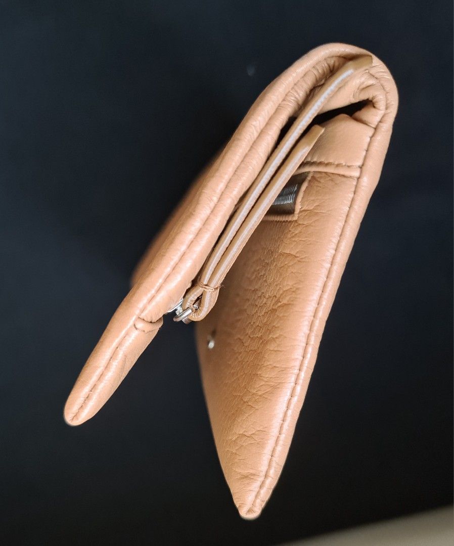 Prada Vitello Cervo Leather Wallet (Category: Luxury Bags & Wallets) located in Mandaluyong City. Submitted by the_luxury_hub (Listing ID 1463210104, Image 3). Description: - Authentic Prada wallet - Natural color - Made from Vitello Cervo leather - Comes with original box and authenticity cards - Interior features Prada logo lining and metal plaque - Secure snap button closure - Plenty of space for cards and cash .