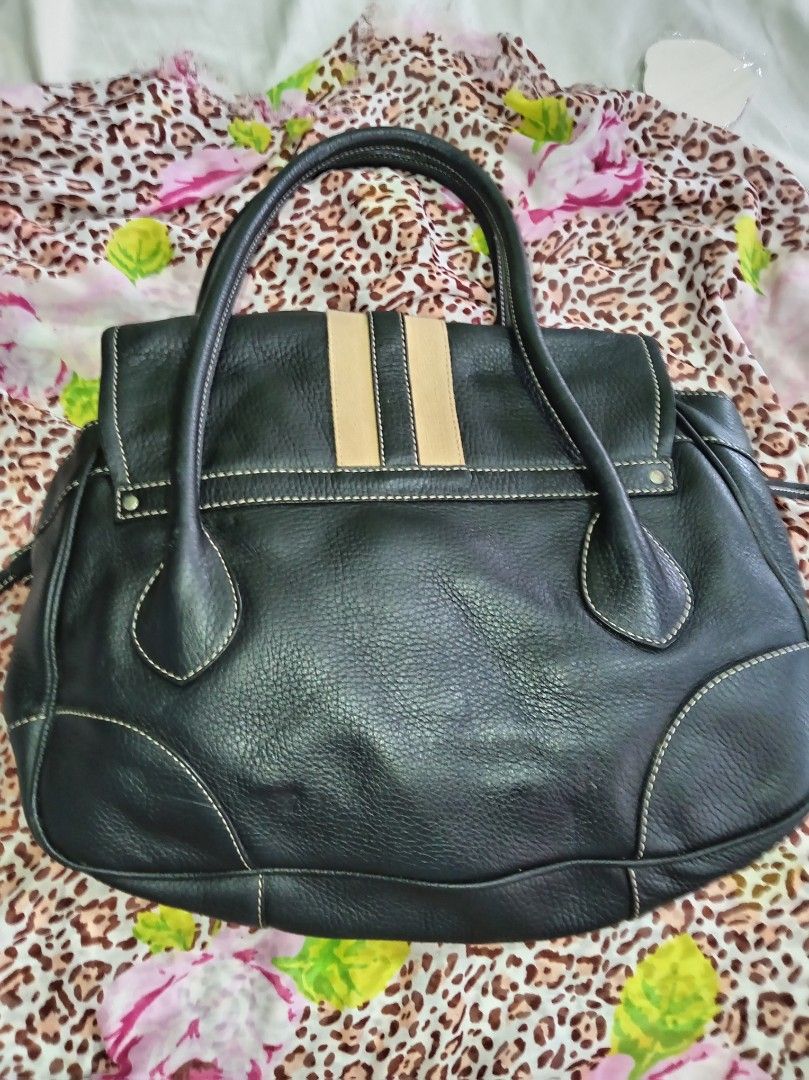 Prada Vitello Daino stripe (Category: Luxury Bags & Wallets) located in Malolos. Submitted by shoptokyothrift (Listing ID 1463203533, Image 3). Description: Lampo zip With white tag PRADA Vintage Leather Stripe Top Handle Bag Pre-loved/vintage condition. Shows signs of age and use, Made in Italy. As is Please see all photos carefully. Japan sourced.