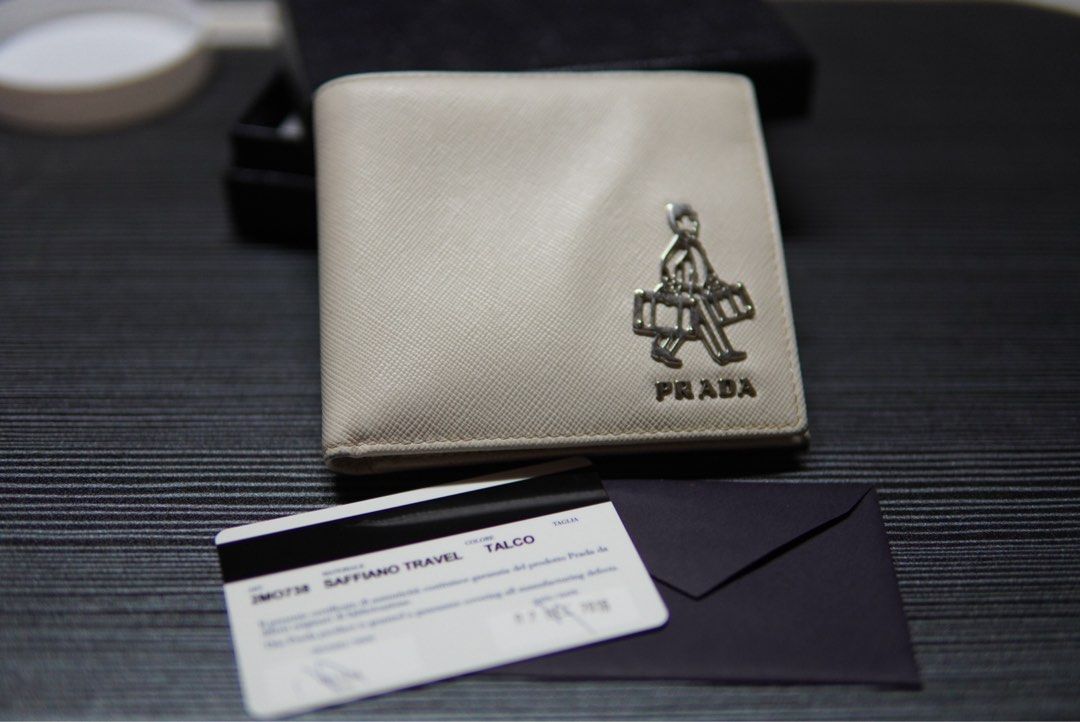 Prada White Bi-fold Wallet (Category: Luxury Bags & Wallets) located in Davao. Submitted by nomadfits (Listing ID 1463250472, Image 2). Description: Decluttering some personal items Location: Davao All items plus sf via lbc Includes box.