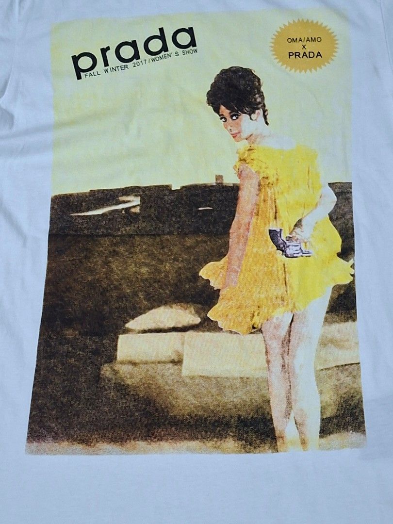 Prada's Fall/Winter 2017 "Poster Girl" (Category: Shirts) located in Masinloc. Submitted by juancarlob98860 (Listing ID 1463262168, Image 2). Description: Prada's Fall/Winter 2017 "Poster Girl" Size on Tag: Medium Dimes:17×25 Color Rate:9/10 Condition 8.5/10 Issue: pinhole on the sleeve.
