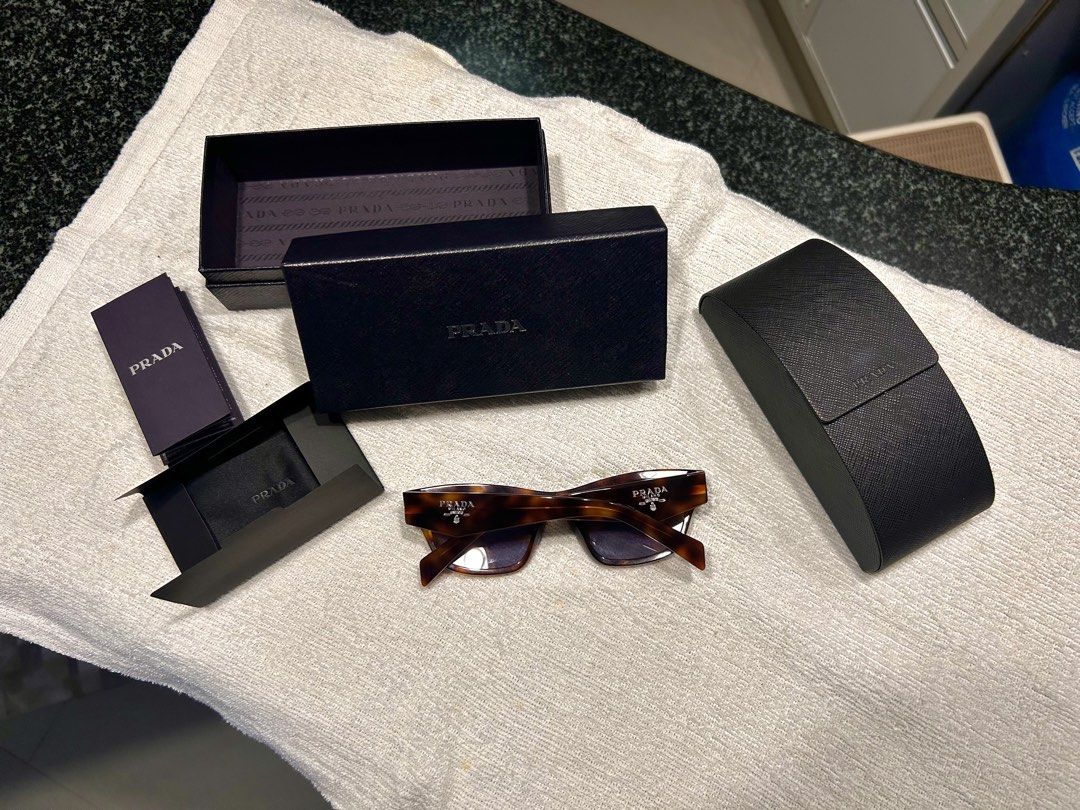 Pràda Classic Tortoise with Grey Lenses (Category: Sunglasses & Eyewear) located in Quezon City. Submitted by jaypee.abergas (Listing ID 1463185006, Image 2). Description: Pràda Classic Tortoise with Grey Lenses Seldom used Unisex Bought for 30k 20k asking Dm .