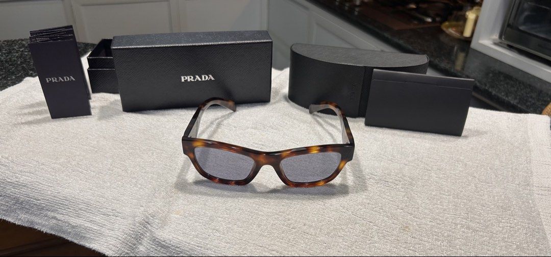 Pràda Classic Tortoise with Grey Lenses (Category: Sunglasses & Eyewear) located in Quezon City. Submitted by jaypee.abergas (Listing ID 1463185006, Image 1). Description: Pràda Classic Tortoise with Grey Lenses Seldom used Unisex Bought for 30k 20k asking Dm .