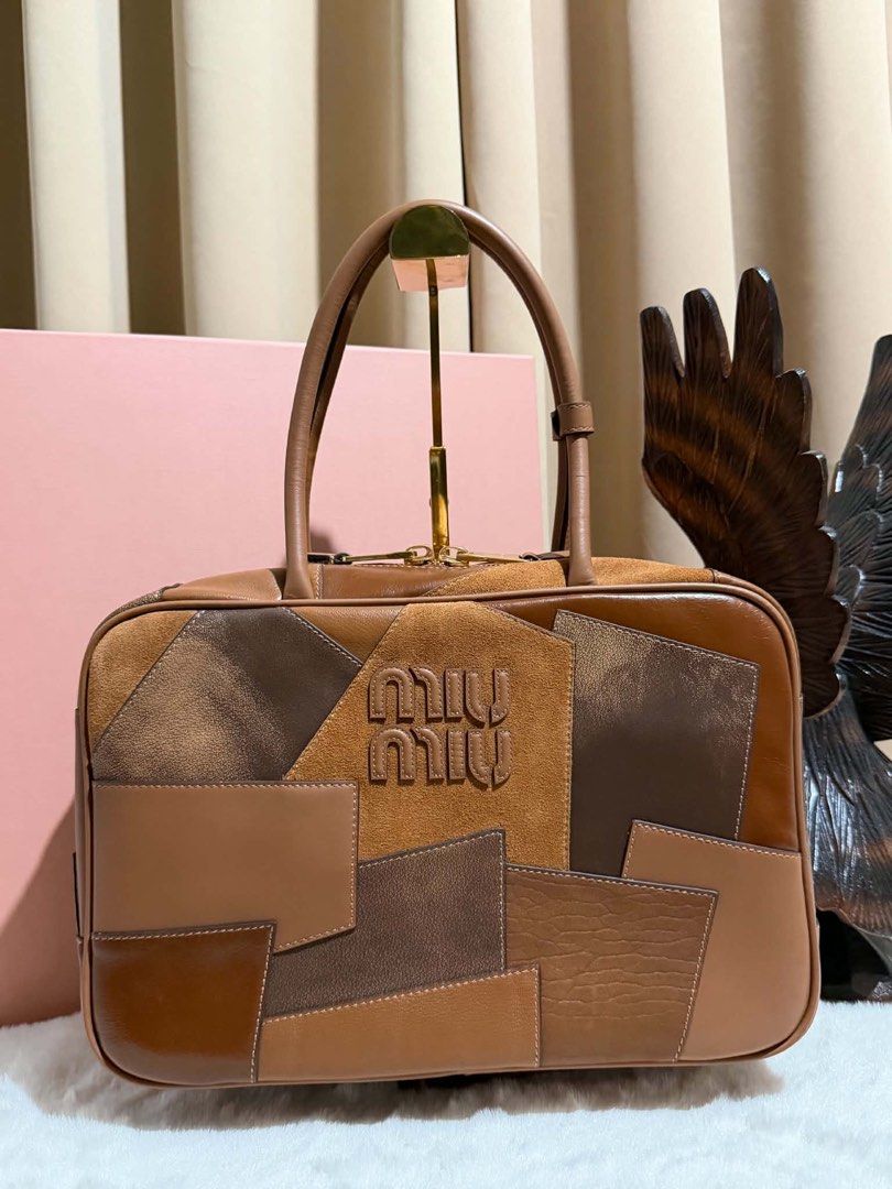 Preloved Leather Patchwork Beau (Category: Luxury Bags & Wallets) located in Manila. Submitted by bagsandmanymanymore1 (Listing ID 1463247101, Image 1). Description: Preloved Miumiu Patchwork Beau Bag Lambskin leather Size 34cm(L) x 23cm(H) x 10cm(W) Leather handle Gold-toned hardware Zipper closure RiRi zipper Patchwork workmanship .