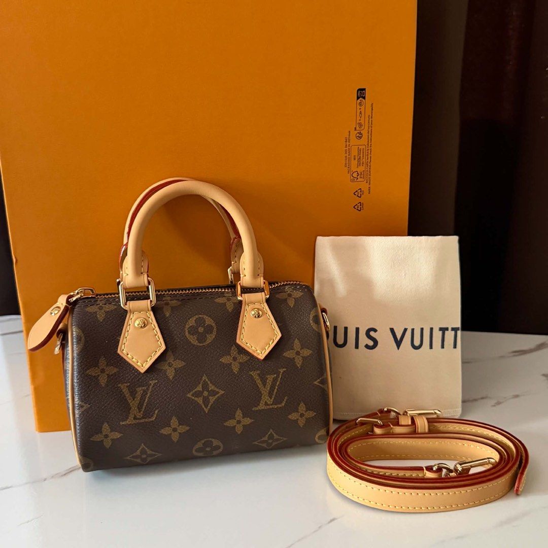 Sale‼️Preloved Nano Speedy Monogram (Category: Luxury Bags & Wallets) located in Manila. Submitted by bagsandmanymanymore1 (Listing ID 1463250262, Image 1). Description: Preloved Nano Speedy Monogram Size 16cm(L) x 10cm(H) x 7.5cm(W) Monogram coated canvas Colored cowhide leather trim Gold-toned hardware Zip closure Fit 6.7 inches smartphone Strap:Removable, Adjustable Handle Double Strap Drop 45.5cm Strap Drop Max 54.0cm Made in France.