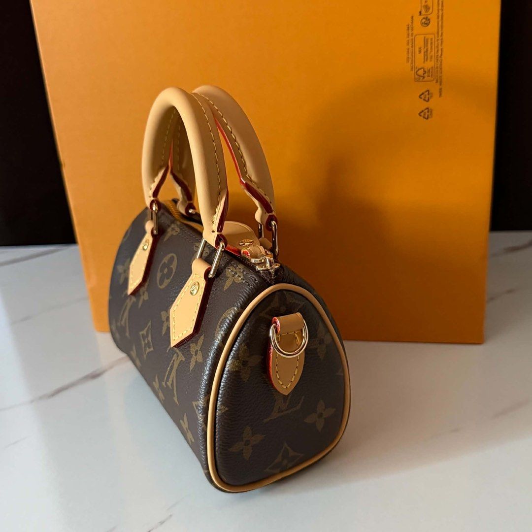 Sale‼️Preloved Nano Speedy Monogram (Category: Luxury Bags & Wallets) located in Manila. Submitted by bagsandmanymanymore1 (Listing ID 1463250262, Image 2). Description: Preloved Nano Speedy Monogram Size 16cm(L) x 10cm(H) x 7.5cm(W) Monogram coated canvas Colored cowhide leather trim Gold-toned hardware Zip closure Fit 6.7 inches smartphone Strap:Removable, Adjustable Handle Double Strap Drop 45.5cm Strap Drop Max 54.0cm Made in France.