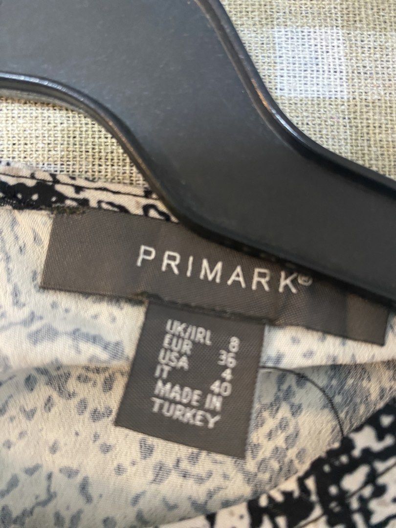Primark Snake Print Long Sleeve Top (Category: Longsleeves) located in Cavite. Submitted by yc.shoppemnl (Listing ID 1463125713, Image 3). Description: - Stylish Primark long sleeve top - Features a cool snake print - Adjustable tie details on the sleeves - Versatile: pairs well with jeans or skirts - Made in Turkey.