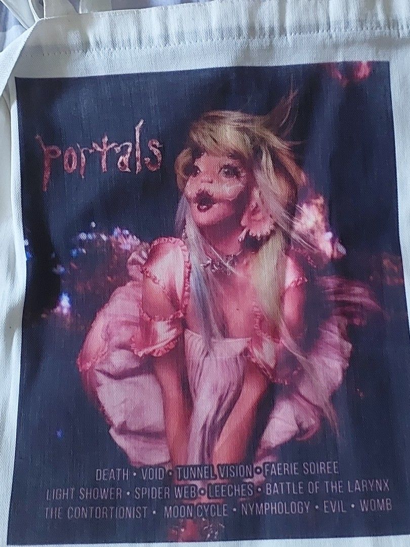 PRINTED MELANIE MARTINEZ TOTE BAG (Category: Luxury Bags & Wallets) located in Las Pinas. Submitted by g.bonx (Listing ID 1463200055, Image 1). Description: take note that this is a printed on melanie martinez portals and its not the actual merchandise bought ° MOP: gcash ° MOD: jnt only DM for more further informations ‼️ loc: las pinas city.