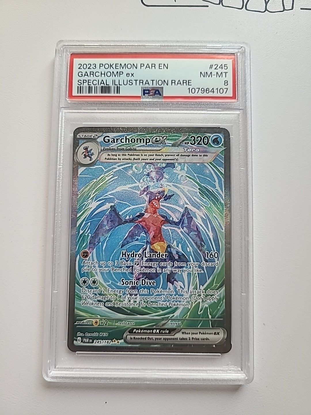 PSA 8 Garchomp EX 245/182 Paradox Rift Secret Illustration Rare Pokemon Card （分類：鑑定單卡）位於 Hong Kong。 由 carousellglobal_hk 提交（商品編號 1451151362，圖片 1）。簡介： [Card Size] Standard [Attribute/MTG:Color] Water [Autographed] No [Set] Paradox Rift [Speciality] EX [Character] Garchomp [Year Manufactured] 2023 [Material] Card Stock [Age Level] 6+ [Vintage] No [Rarity] Secret Illustration Rare [Game] Pokémon TCG [Language] English [Illustrator] Oswaldo KATO [Car
