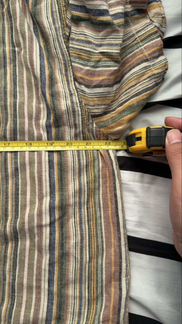 Pull & Bear Striped Short Sleeve Shirt (Category: Shirts) located in Manila. Submitted by jmbb00.03 (Listing ID 1463136575, Image 3). Description: - Brand: Pull & Bear - Style: Short-sleeved shirt - Pattern: Vertical stripes - Colors: Earthy tones (brown, beige, yellow, blue) - Fit: Relaxed - Features: Collar, button-up front - Occasion: Everyday wear, beach vibe - Styling: Pairs well with shorts or jeans.