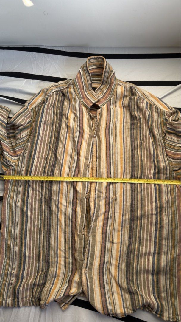 Pull & Bear Striped Short Sleeve Shirt (Category: Shirts) located in Manila. Submitted by jmbb00.03 (Listing ID 1463136575, Image 2). Description: - Brand: Pull & Bear - Style: Short-sleeved shirt - Pattern: Vertical stripes - Colors: Earthy tones (brown, beige, yellow, blue) - Fit: Relaxed - Features: Collar, button-up front - Occasion: Everyday wear, beach vibe - Styling: Pairs well with shorts or jeans.