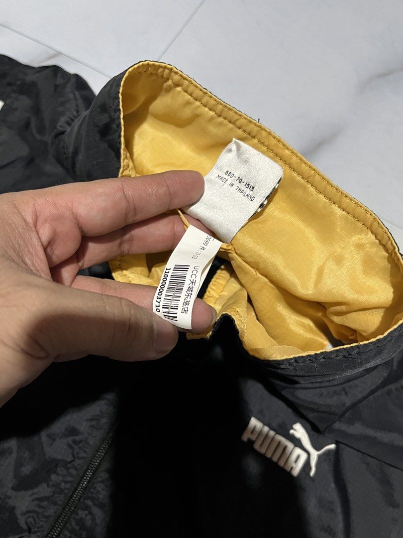 Puma Track Jacket Black Yellow White Size M (Category: Coats, Jackets and Outerwear) located in Cavite. Submitted by christianzuuu (Listing ID 1463131215, Image 3). Description: - Classic Puma track jacket - Color: Black with white and yellow accents - Features: Full zip closure, elasticated cuffs and hem - Perfect for casual wear or sports - Size: Medium (M) - Origin: Made in Thailand.