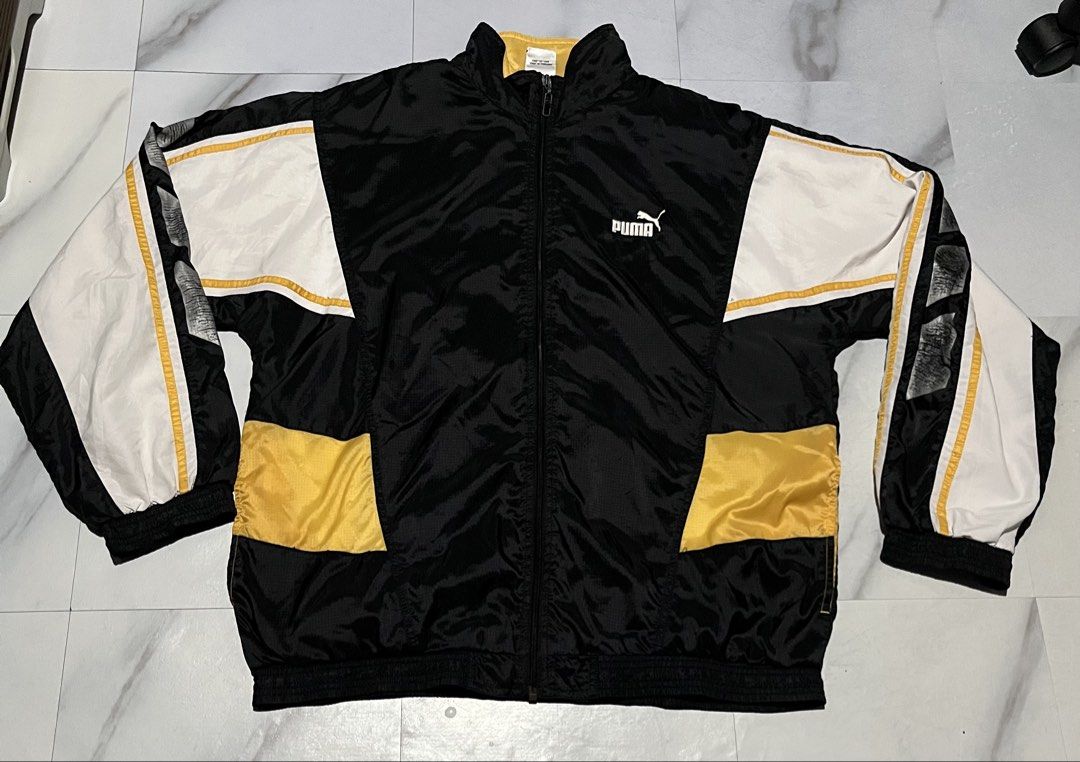 Puma Track Jacket Black Yellow White Size M (Category: Coats, Jackets and Outerwear) located in Cavite. Submitted by christianzuuu (Listing ID 1463131215, Image 1). Description: - Classic Puma track jacket - Color: Black with white and yellow accents - Features: Full zip closure, elasticated cuffs and hem - Perfect for casual wear or sports - Size: Medium (M) - Origin: Made in Thailand.