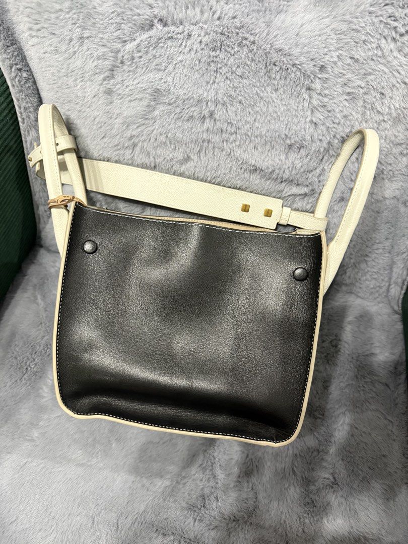 RABEANCO Two-tone Leather Handbag with Shoulder Strap (Category: Shoulder Bags) located in Paranaque City. Submitted by hamcynn (Listing ID 1463321640, Image 2). Description: Letting go of what I don’t use anymore. This was a handbag purchased in 2024. Very seldom used, maybe less than 5x. I prefer bigger bags, backpack. Super impulsive purchase in Telford Plaza during my walk going to Kowloon Bay Station, HK. .