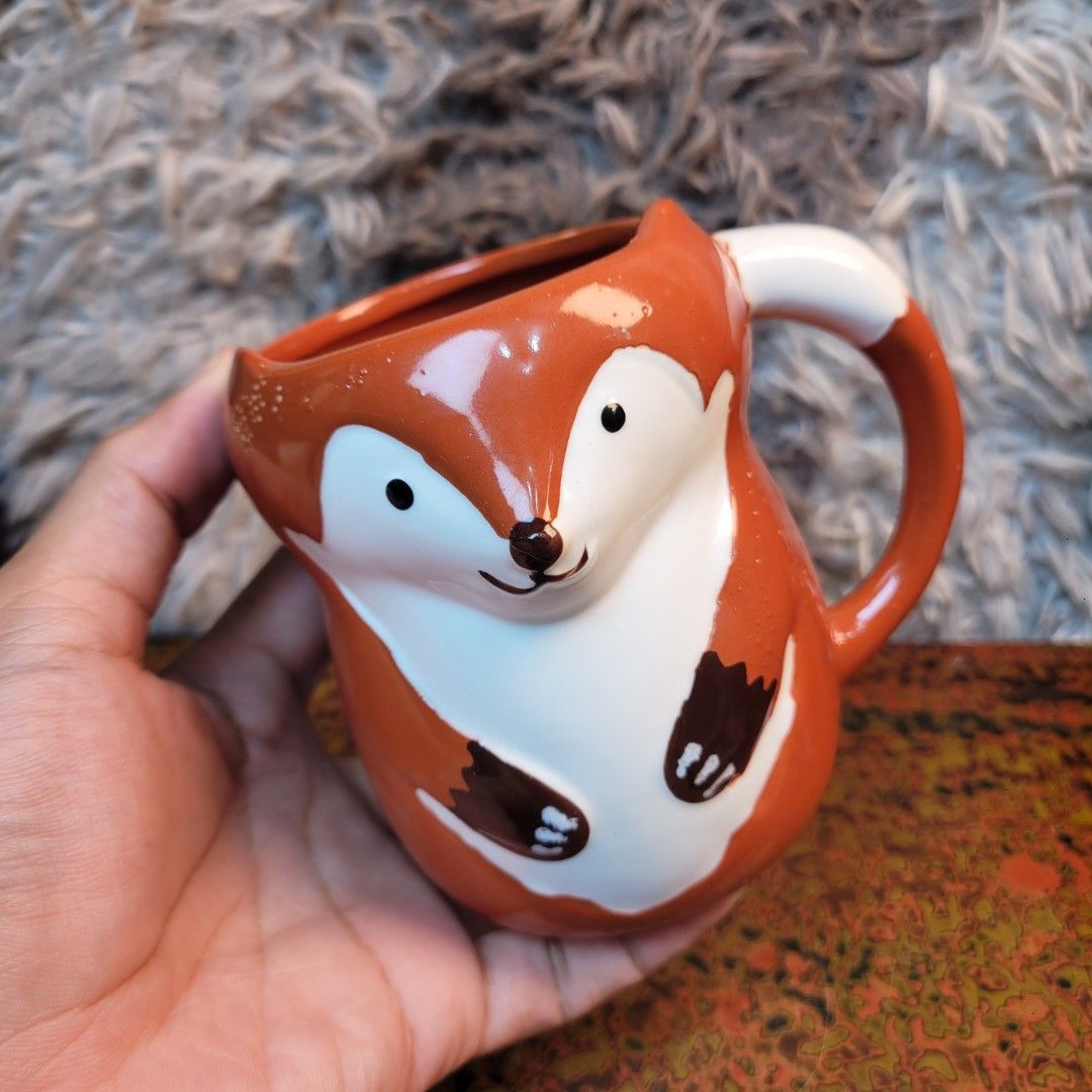 Rare Sculpted Fox Ceramic Novelty Mug! (Category: Coffee & Tea Tableware) located in Pasig City. Submitted by hoa_japan_surplus_32023 (Listing ID 1463230042, Image 2). Description: 5x4.5 inches, approx. 🗣Note: With a minor factory glaze line near the handle. ❌️NON-COD ✅️ PAYMENT FIRST POLICY ✅️ FIRST TO PAY _____________________________________________ ‼️SHIPPING OPTION‼️ 📌Flash Express, J&T, Gogo Express, Lalamove or Personal Pick-up Location: