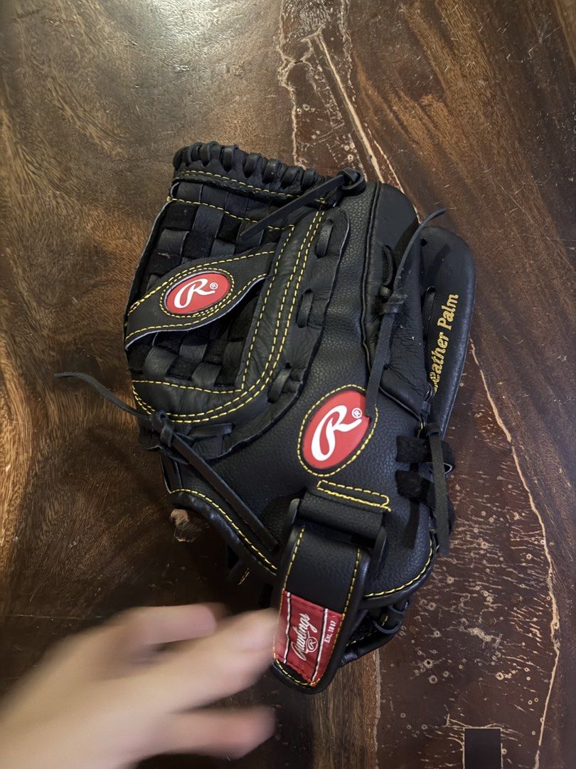 Rawlings Black Leather Baseball Glove (Category: Other Sports Equipment and Supplies) located in Manila. Submitted by jacobark1234 (Listing ID 1463124842, Image 1). Description: - Black Rawlings baseball glove - Genuine leather palm for durability - Adjustable strap for a secure, custom fit - Perfect for playing catch or in a game - Field-ready condition - Feel free to ask any questions!.