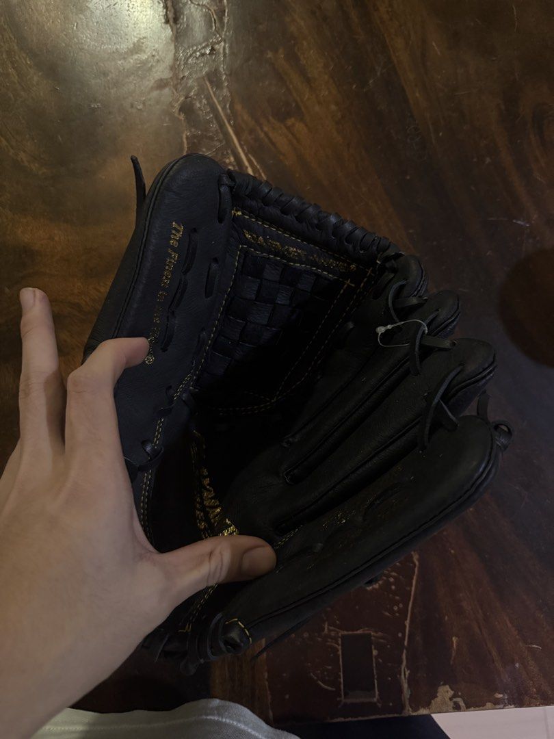 Rawlings Black Leather Baseball Glove (Category: Other Sports Equipment and Supplies) located in Manila. Submitted by jacobark1234 (Listing ID 1463124842, Image 3). Description: - Black Rawlings baseball glove - Genuine leather palm for durability - Adjustable strap for a secure, custom fit - Perfect for playing catch or in a game - Field-ready condition - Feel free to ask any questions!.