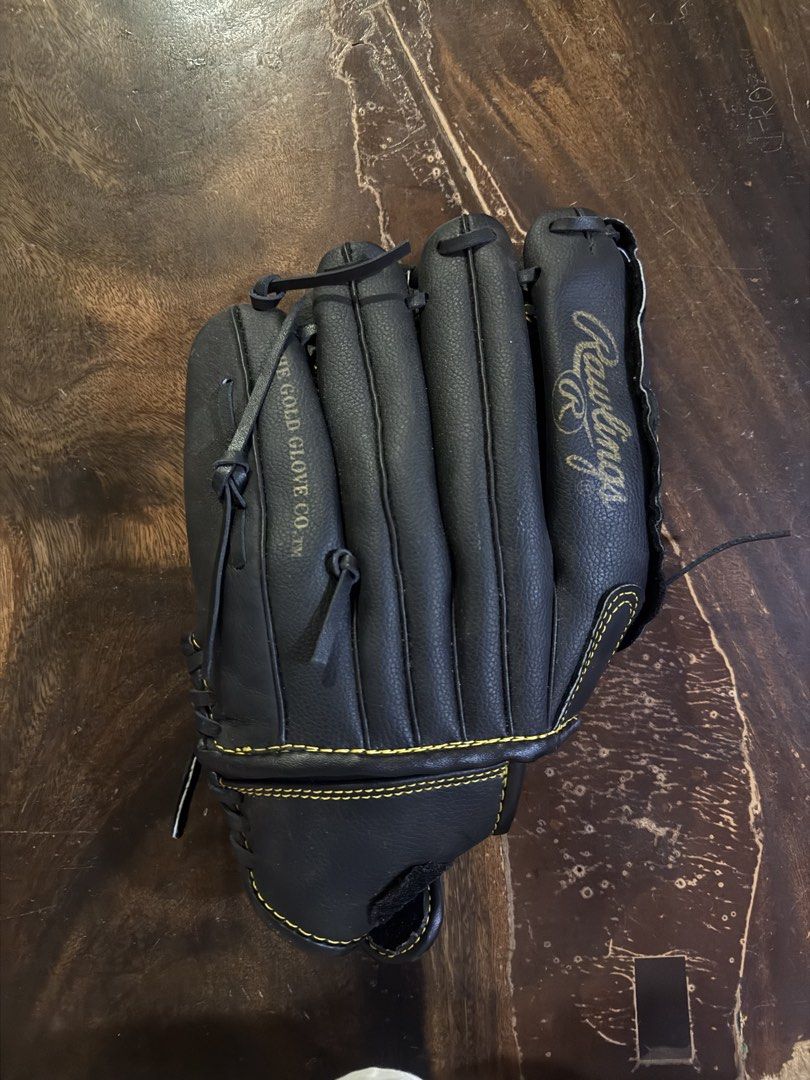 Rawlings Black Leather Baseball Glove (Category: Other Sports Equipment and Supplies) located in Manila. Submitted by jacobark1234 (Listing ID 1463124842, Image 2). Description: - Black Rawlings baseball glove - Genuine leather palm for durability - Adjustable strap for a secure, custom fit - Perfect for playing catch or in a game - Field-ready condition - Feel free to ask any questions!.