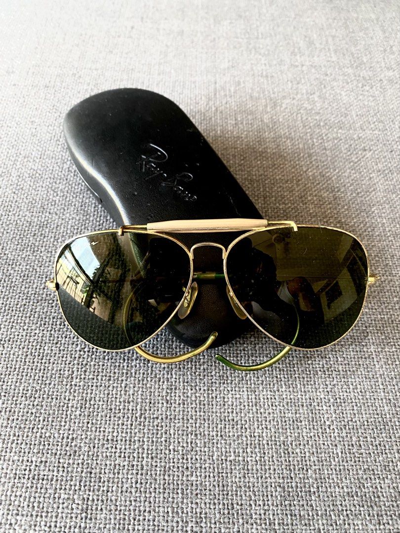 Vintage Ray-Ban B&L Shooter Aviator Sunglasses (Category: Sunglasses & Eyewear) located in Makati City. Submitted by lucid_soul (Listing ID 1463166041, Image 3). Description: - Vintage Ray-Ban Shooter Aviator sunglasses - Made in USA - Gold frame with green lenses - Smooth movement: All parts working - Great condition for a vintage piece - Comes with original Ray-Ban hard case - Timeless and iconic style - Vintage Mojo included .