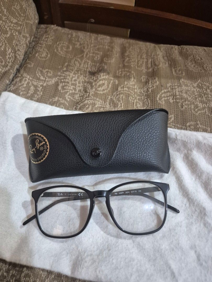 Ray-Ban RB 5387F Black Eyeglasses with Case Preloved (Category: Sunglasses & Eyewear) located in Gattaran. Submitted by uploadtounload (Listing ID 1463186596, Image 1). Description: - Authentic black Ray-Ban eyeglasses - Includes original black Ray-Ban case - Classic and simple frame design, perfect for daily use - Clear, ready-to-wear lenses - Sold as is.