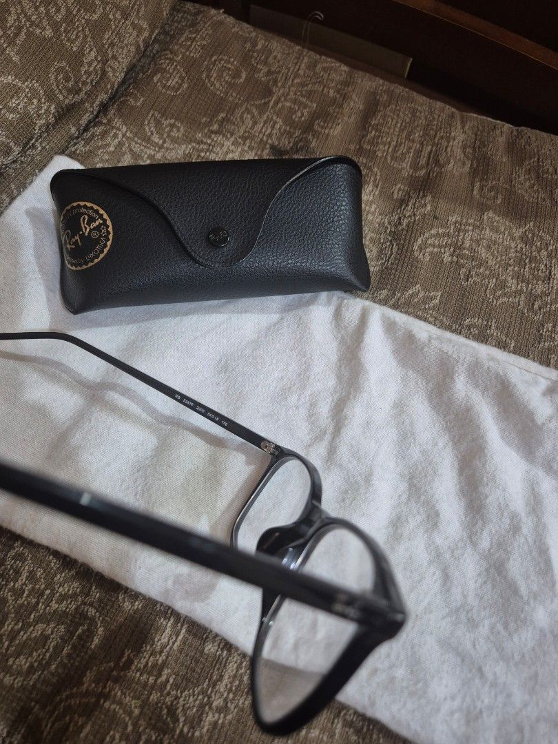 Ray-Ban RB 5387F Black Eyeglasses with Case Preloved (Category: Sunglasses & Eyewear) located in Gattaran. Submitted by uploadtounload (Listing ID 1463186596, Image 2). Description: - Authentic black Ray-Ban eyeglasses - Includes original black Ray-Ban case - Classic and simple frame design, perfect for daily use - Clear, ready-to-wear lenses - Sold as is.