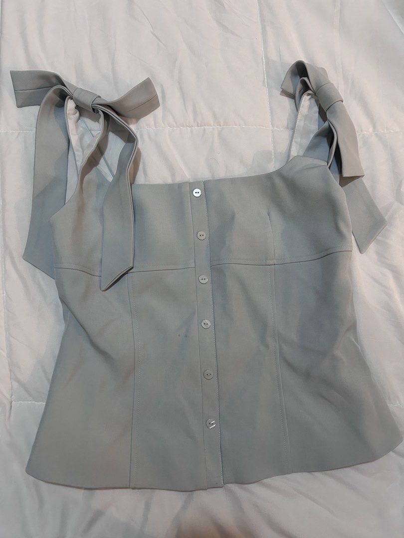 Rechic Square Neck Top Bow Light Blue (Category: Blouses) located in Paranaque City. Submitted by bahotaho (Listing ID 1463280797, Image 1). Description: - Bought in Hanoi Vietnam last Dec 2025 for 545k VND (~₱1300) - Tried on once, had it altered to fit my frame (Small to Medium) - Still has tag attached - This best fits a medium now despite being XL on tag - Such a pretty color and so flattering! - Very structured (material feels like those use