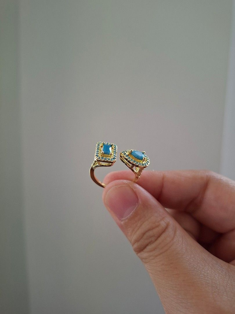Rectangular and Pear Cut Turquoise Illusion Ring Adjustable (Category: Rings) located in Dasmarinas. Submitted by danabrie22 (Listing ID 1463194145, Image 2). Description: adjustable size 5 - 9 very well-made, excellent crafstmanship 10/10 condition brand new stainless steel & turquoise-colored zirconia stones made in Hongkong.