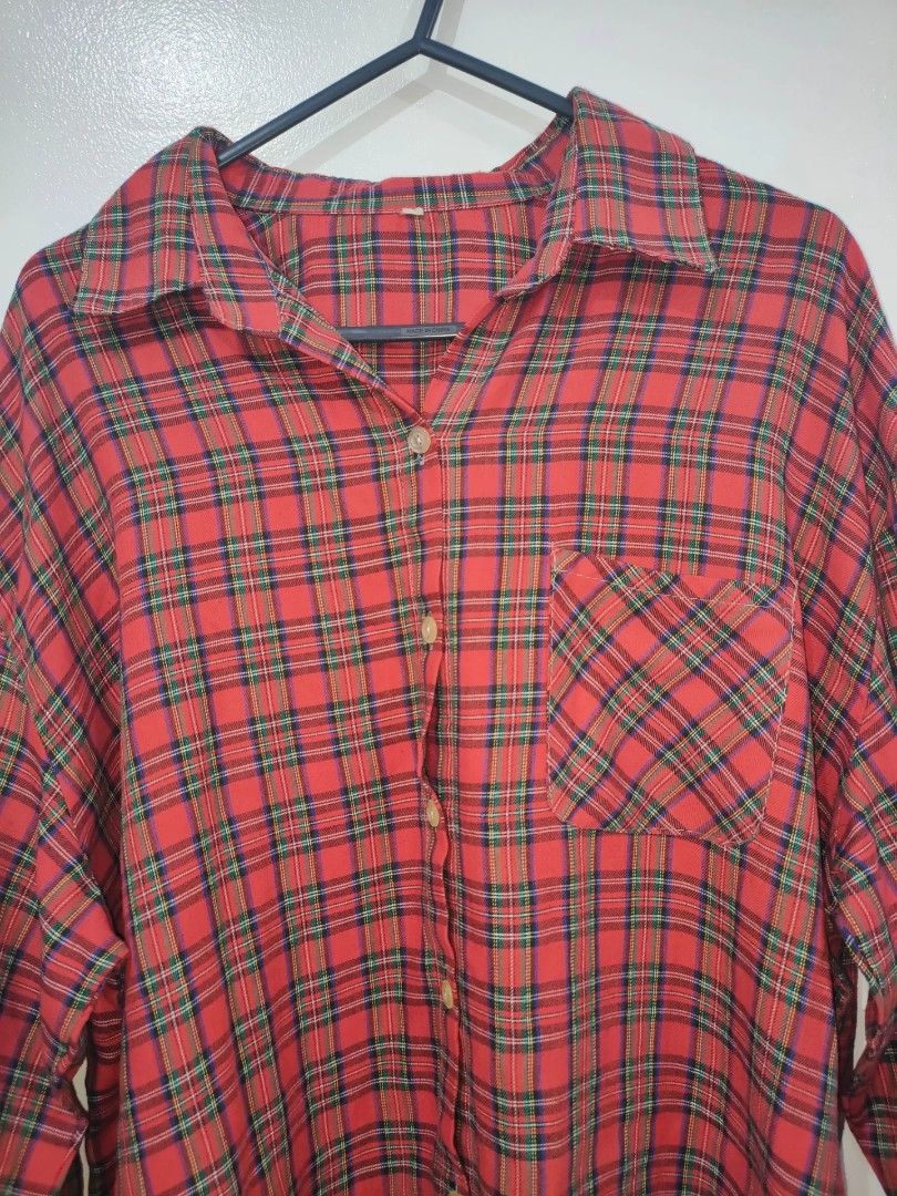Red Plaid Long Sleeve Button Up Shirt (Category: Tshirts & Polo Shirts ) located in Quezon City. Submitted by maxsab (Listing ID 1463264777, Image 2). Description: - Classic red plaid pattern - Long sleeves with button cuffs - Single chest pocket - Button-up front - Versatile for layering or standalone wear - Comfortable and casual style.