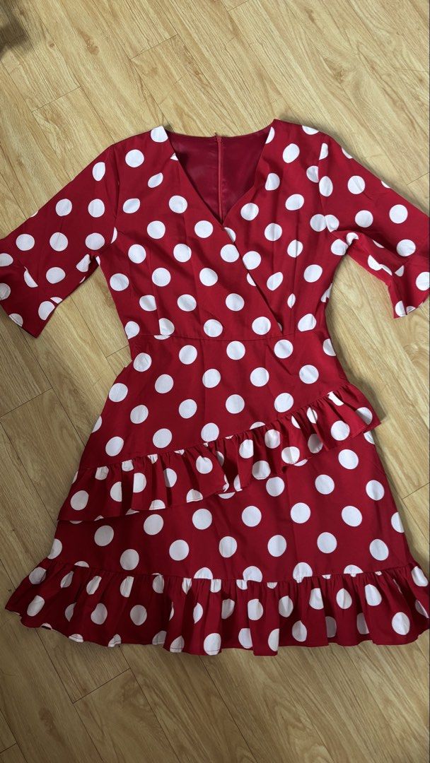 Red Polka Dot Ruffle Wrap Dress (Category: Dresses) located in Cainta. Submitted by prelovebytish (Listing ID 1463159944, Image 1). Description: - Adorable red dress with classic white polka dots. - Flattering wrap style with a chic V-neck. - Fun ruffle details on the skirt for a playful touch. - Versatile three-quarter sleeves. - Ideal for parties, gatherings, or a stylish casual day out. - Combines comfort with a fashionable look..