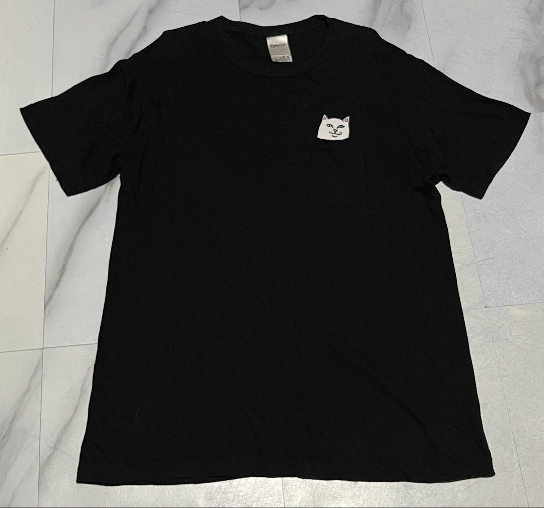 RIPNDIP T-Shirt Black Pocket Tee (Category: Tshirts & Polo Shirts ) located in Cavite. Submitted by christianzuuu (Listing ID 1463133697, Image 1). Description: - Brand: RIPNDIP - Color: Black - Size: Medium - Design: Iconic RIPNDIP middle finger cat logo on chest pocket - Material: Comfortable fabric - Occasion: Perfect for casual wear.